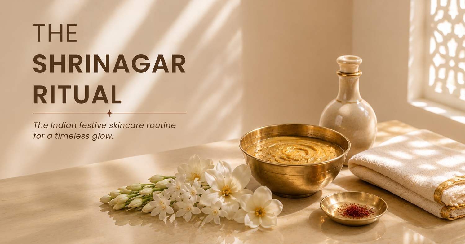 The Shringar Ritual: Indian festive skincare setup featuring a traditional brass ubtan bowl, saffron strands, jasmine flowers, ceramic oil bottle, and folded cotton cloth in warm natural sunlight.